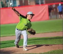  ?? Photo by Ernest A. Brown ?? Tigers pitcher Carson Mellon throws the game’s opening pitch against the Colts during the first game of the Little League season at Randy Hien Field in Lincoln Thursday evening.