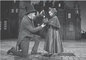  ?? MICHAEL BROSILOW ?? Jonathan Wainwright and Olivia Vitrano perform in Milwaukee Repertory Theater’s “A Christmas Carol.”