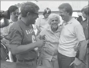  ?? MARK FOLEY — THE ASSOCIATED PRESS FILE ?? Lillian Carter is flanked by her sons Jimmy, right, and Billy as she met them down at Billy’s gas station, where the Carters and neighbors cleaned fish prior to a town cookout, June 26, 1976.