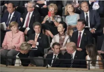  ?? KAY NIETFELD — POOL PHOTO VIA AP ?? Leaders, including German Chancellor Angela Merkel, left, and their partners attend a concert at the Elbphilhar­monie concert hall on the first day of the G-20 summit in Hamburg, northern Germany, Friday.