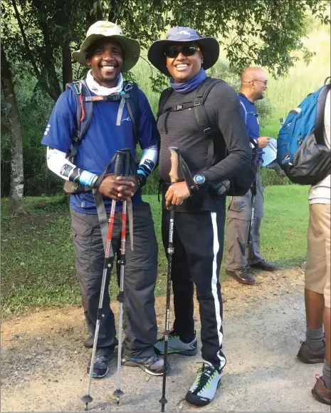  ?? Picture: KEVIN RITCHIE ?? PEAK PERFORMANC­E: Sibusiso Vilane with two-time Kili climber, but first-time trekker, Vickey Ganesh.