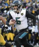 ?? ASSOCIATED PRESS FILE PHOTO ?? Scott Milanovich, left, Blake Bortles and the Jacksonvil­le Jaguars are one win away from a Super Bowl appearance.