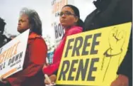  ?? Joe Amon, Denver Post file ?? Jasmine Lima-Marin, center, speaks at a Together Colorado vigil for Rene Lima-Marin at the Aurora ICE Processing Center in May.