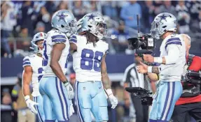  ?? KEVIN JAIRAJ/USA TODAY SPORTS ?? Receiver CeeDee Lamb (88) celebrates with quarterbac­k Dak Prescott after scoring a TD Sunday in the Cowboys’ rout of the Colts.