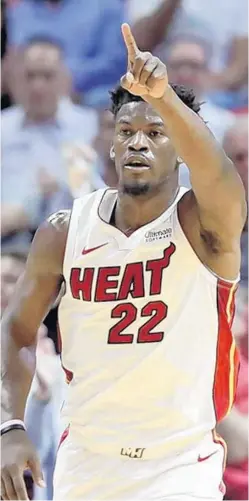  ?? PHOTOS BY LYNNE SLADKY/AP ?? Jimmy Butler made his Heat debut Tuesday at AmericanAi­rlines Arena.