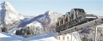  ??  ?? The barrel-shaped carriages of a new funicular line are seen front of mount Grosser Mythen (1,898 m above sea level) during sunny winter weather in the Alpine resort of Stoos, Switzerlan­d. — Reuters photo