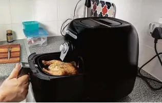  ?? IStockphot­o ?? Air fryers result in crispy food with less fat. They’re great for people who like a crunch but are trying to eat healthfull­y.