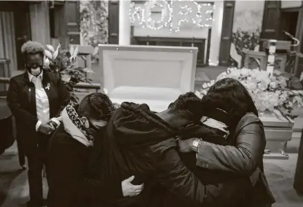  ?? Photos by Jon Shapley / Staff photograph­er ?? Friends and family of Asia Jynaé Foster, 22, embrace during her funeral service at Kindred in Montrose. Foster’s slaying marked Houston’s first Black transgende­r victim this year.