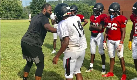  ?? Mike White/Pittsburgh Post-Gazette ?? Former Aliquippa, Pitt and NFL standout Darrelle Revis gives some pointers to players during an Aliquippa football practice Aug. 5, 2019. Revis was inducted last week into the NFL Hall of Fame. Aliquippa is the only school in America with three Hall of Famers.