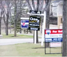  ?? MICHELLE HOFER ?? Resale of multi-family homes pulled back in Calgary neighbourh­oods last month in comparison to February of 2017.