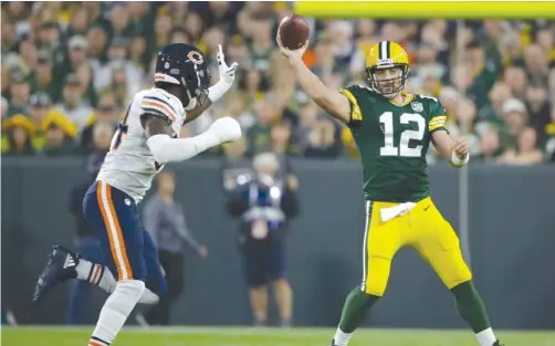  ?? MORRY GASH/AP ?? Packers QB Aaron Rodgers destroyed the Bears’ defense in the second half Sunday night. His predecesso­r, Brett Favre, used to do the same thing.