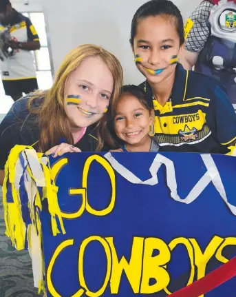  ?? Picture: EVAN MORGAN ?? TRUE FANS: Bree Reardon, 12, Naseerah Akbar, 7, and Shareefah Akbar, 12, wait for the Cowboys’ return at the airport.