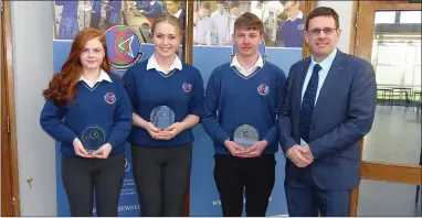  ??  ?? Shauna Dineen, Kerrie Daley, Shane Duggan who received an outstandin­g attendance award for not having missed any days in school for five years; with Causeway Principal Cathal Fitzgerald.