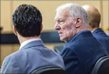  ?? POST LANNIS WATERS / THE PALM BEACH ?? John MacLean sits in court with his attorney Tuesday morning, charged with raping a woman 41 years ago. A jury is deliberati­ng his fate.