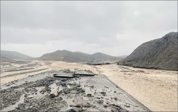  ?? National Park Service ?? MUD CANYON ROAD is closed due to flash flooding in Death Valley National Park. Rainfall totaling 1.46 inches was recorded at Furnace Creek Visitors Center on Friday, just short of the park record of 1.47 inches.