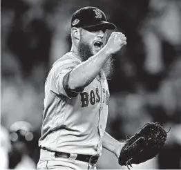  ?? ELSA/GETTY ?? Red Sox closer Craig Kimbrel celebrates the last out, which survived a replay challenge and ended the ALDS.