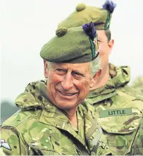  ??  ?? Prince Charles visits the 51st Highland, 7th Battalion The Royal Regiment of Scotland at Barry Buddon Training Camp in Carnoustie in September 2013.