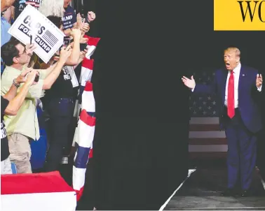  ?? NICHOLAS KAMM / AFP VIA GETTY IMAGES ?? U.S. President Donald Trump arrives at Saturday’s campaign rally at the BOK Center in Tulsa, Okla.