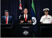  ?? LUKAS COCH — AAP IMAGE VIA AP ?? Australian Defense Industry Minister Pat Conroy, left, Australian Deputy Prime Minister Richard Marles and head of the Nuclear Powered Submarine Task Force Vice Adm. Jonathan Mead, right, speak to the media during a press conference at Parliament House in Canberra on Tuesday.