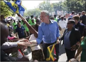  ?? KEVIN HAGEN — ASSOCIATED PRESS ?? New York Mayor Bill de Blasio greets spectators at the West Indian Day Parade on Monday, Sept. 4, 2017, in the Brooklyn borough of New York. The parade, one of the largest celebratio­ns of Caribbean culture in the U.S., is being held amid ramped-up...