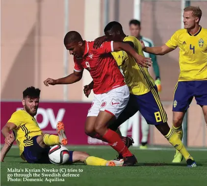  ??  ?? Malta's Kyrian Nwoko (C) tries to go through the Swedish defence Photo: Domenic Aquilina