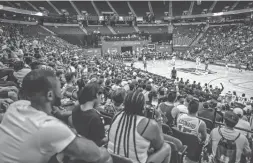  ??  ?? Fans watch the Wizards-Spurs game on Sunday, the third day of the NBA Summer League, at the University of Nevada-Las Vegas.