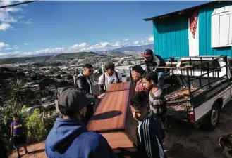  ?? Rodrigo Abd / Associated Press ?? Relatives carry a coffin containing the remains of Kimberly Fonseca, 19. As the electoral count entered its sixth day Saturday, Fonseca was shot to death at an opposition party protest.