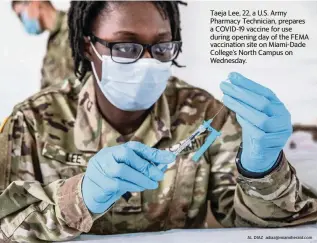  ?? AL DIAZ adiaz@miamiheral­d.com ?? Taeja Lee, 22, a U.S. Army Pharmacy Technician, prepares a COVID-19 vaccine for use during opening day of the FEMA vaccinatio­n site on Miami-Dade College’s North Campus on Wednesday.