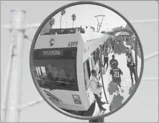  ??  ?? STAFF FILE PHOTO Fans board the VTA light rail trains following the San Francisco 49ers’ second preseason NFL football game, against the San Diego Chargers in 2014 at Levi’s Stadium in Santa Clara.