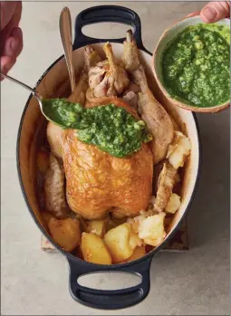  ?? PHOTOS COURTESY OF DAVID LOFTUS ?? Chef Jamie Oliver's recipe for pot-roast chicken and fondant potatoes was inspired by a recent trip to Barcelona, Spain. Herb-packed salsa goes on top.