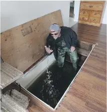  ??  ?? Daniel Doucet has seven feet of water in his basement on rue St-FrancoisXa­vier, although water levels are receding.