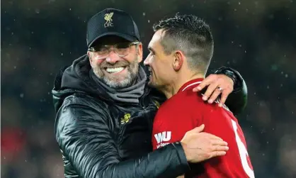  ??  ?? Dejan Lovren embraces Jürgen Klopp after Liverpool’s draw at Manchester United. The defender says the manager has made the team believe. Photograph: Alex Dodd/CameraSpor­t via Getty Images