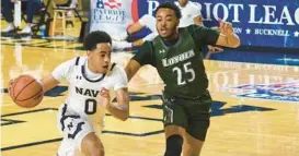  ?? PAUL W. GILLESPIE/BALTIMORE SUN MEDIA ?? After leading the Patriot League in assists per game a year ago, Kenneth Jones, right, has switched positions from point guard to shooting guard to help fill the void left by the transfer of Cam Spencer.