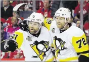  ?? BRUCE BENNETT / GETTY IMAGES ?? After being acquired via trades, Phil Kessel (left) and Patric Hornqvist have the Penguins in search of a second consecutiv­e Stanley Cup.