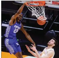  ?? (AP/Knoxville News Sentinel/Caitie McMekin) ?? Kentucky forward Isaiah Jackson dunks over Tennessee’s John Fulkerson on Saturday in Knoxville, Tenn. Jackson had 16 points as the Wildcats won 70-55 for their third consecutiv­e victory.