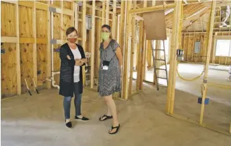  ?? BY LUKE CHRISTOPHE­R FOR FOOTHILLS FORUM ?? CCLC Executive Director Lisa Paine-Wells and Program Director Lisa Pendleton in center’s new building, which is licensed to hold around 20 children and should be ready within weeks.