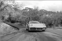  ?? COURTESY OF PORSCHE CARS NORTH AMERICA VIA AP ?? The 2020 Porsche 911, available in base Carrera and Carrera S variants, offers a variety of performanc­e capabiliti­es. It can even be had with all-wheel drive. But how does it fare against its bargain rival, the 2020 Chevy Corvette?