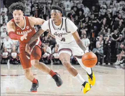  ?? Sam Craft
The Associated Press ?? Texas A&M guard Wade Taylor drives past Alabama guard Mark Sears in the Aggies’ win Saturday at Reed Arena. “In the figurative fights,” A&M coach Buzz Williams said, “they’ve learned not to flinch.”