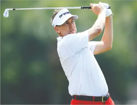  ?? PHOTOS: SAM GREENWOOD/GETTY IMAGES ?? Ian Poulter drives from the 17th tee under ideal conditions on Thursday during the first round of the RBC Heritage at Harbour Town Golf Links in Hilton Head, S.C. The Englishman showed no signs of rust in carding a seven-under 64 to take a share of the lead.