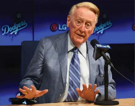  ?? USA TODAY SPORTS FILE PHOTO ?? Los Angeles Dodgers broadcaste­r Vin Scully talks to the media during a news conference before a game between the Los Angeles Dodgers and the Colorado Rockies last September. On Monday, the Dodgers will play their first opening day since 1950 without...