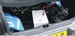  ?? DUTCH DEFENSE MINISTRY VIA AP ?? A photograph released by the Dutch Ministry of Defence shows a rental vehicle’s trunk loaded with a computer, battery and a white transforme­r.