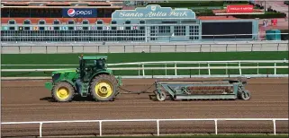  ?? FREDERIC J. BROWN – GETTY IMAGES) ?? More than 12 inches of rain have fallen at the Santa Anita Racetrack in Arcadia since the current meet began on Dec. 26.