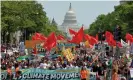  ??  ?? During the People’s Climate March in April 2017, demonstrat­ors filled Pennsylvan­ia Avenue in Washington DC. Photograph: Mike Theiler/Reuters