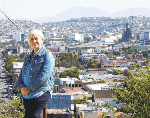  ?? ALEJANDRO TAMAYO U-T ?? Sandra Dibble, former Union-tribune reporter and creator of the Border City podcast, stands outside the Casa de la Cultura on Feb. 16 in Tijuana.