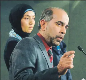  ?? CP PHOTO ?? Canadian Muslim Forum spokespers­on Samah Jebbari (left) listens as President Samer Majzoub responds to a question during a news conference on Parliament Hill in Ottawa Tuesday.