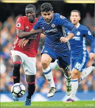  ?? Picture: GETTY IMAGES ?? MAKE WAY: Chelsea’s Diego Costa is closed down by Manchester United’s Eric Bailly during their Premier League match at Stamford Bridge in London yesterday