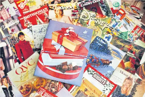  ?? AP ?? This file photo shows a selection of holiday season catalogues.