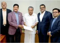  ?? Supplied photo ?? Br Shetty with pinarayi Vijayan and other officials in Thiruvanan­thapuram on Wednesday. —