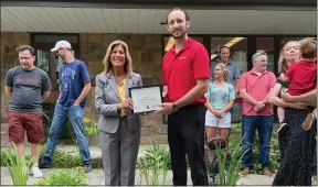  ?? SKYE MASON PHOTO ?? Kyle Magne stands with state Sen. Daphne Jordan outside Magne’s new State Farm agency in Saratoga Springs.