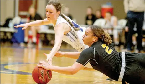  ?? Photo courtesy of JBU Sports Informatio­n ?? John Brown senior Taylor Fergen, top, and Science and Arts’ Kaytlen Johnson dive after a loose ball during Saturday’s game at Bill George Arena. Science and Arts defeated JBU 74-45.